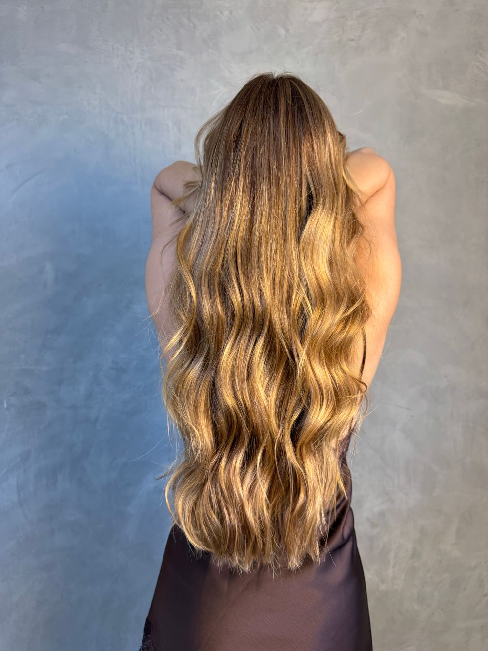 Long, wavy hair seen from behind